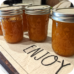 Close-up of jars filled with homemade peach jam