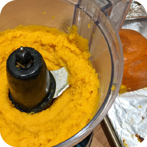 Close-up of freshly blended homemade pumpkin purée in a food processor
